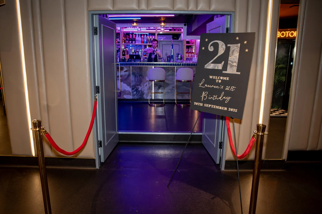 The VIP Room entrance with red ropes and a personalised welcome sign