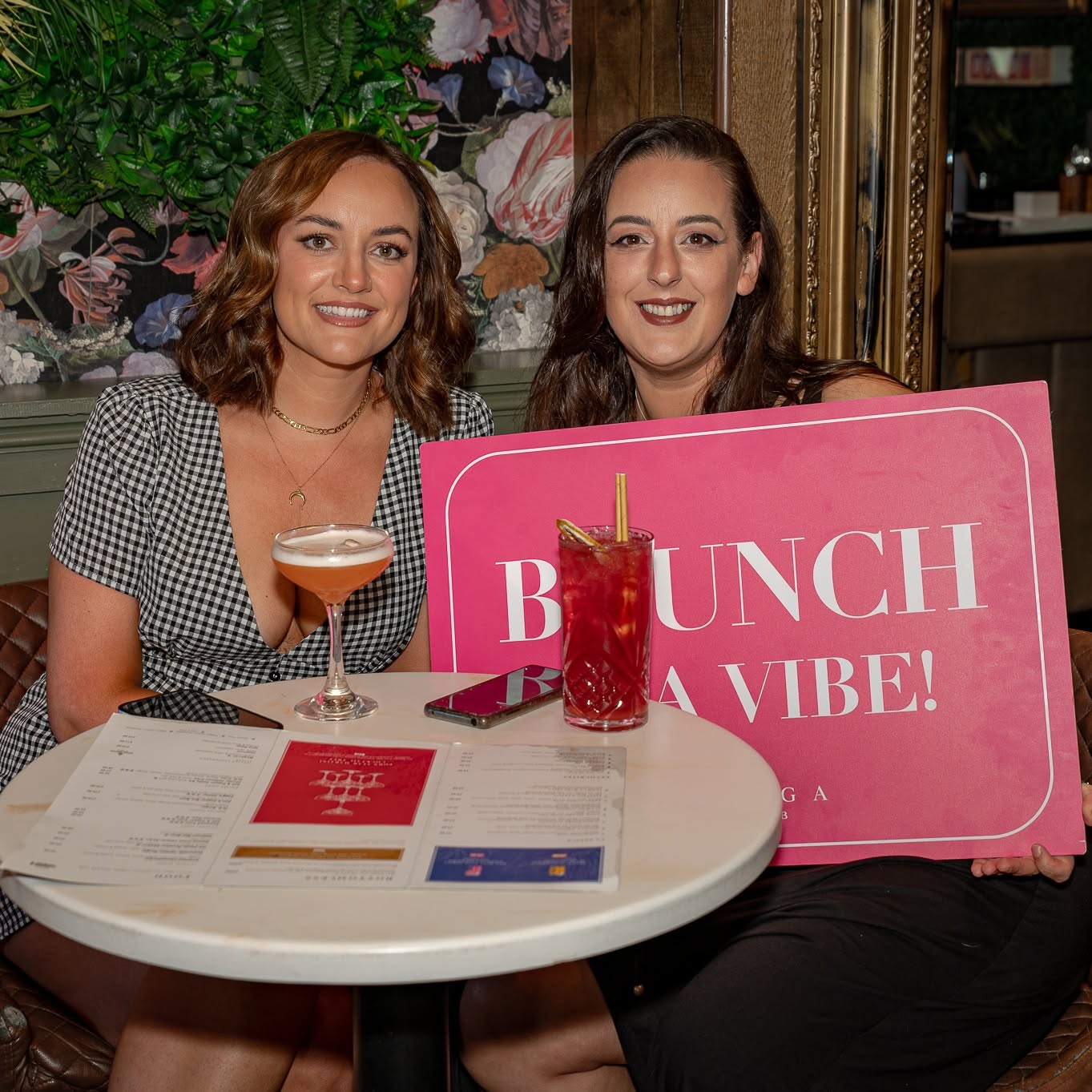 Friends with a Brunch Is A Vibe sign at the table